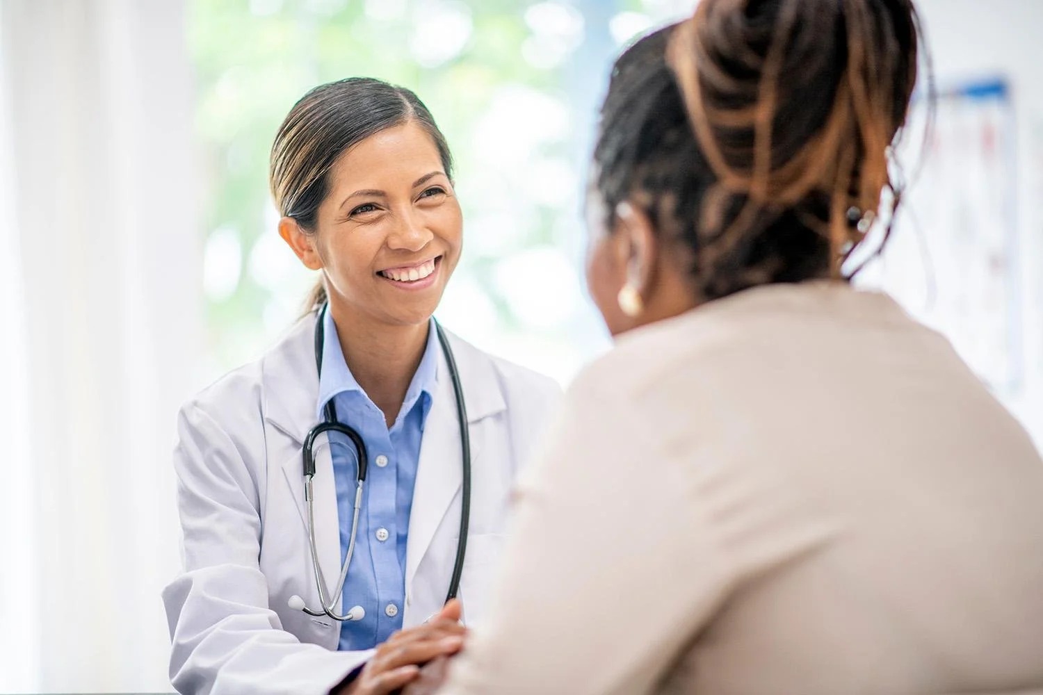 Doctor speaking with patient at Essence Coastal Clinic